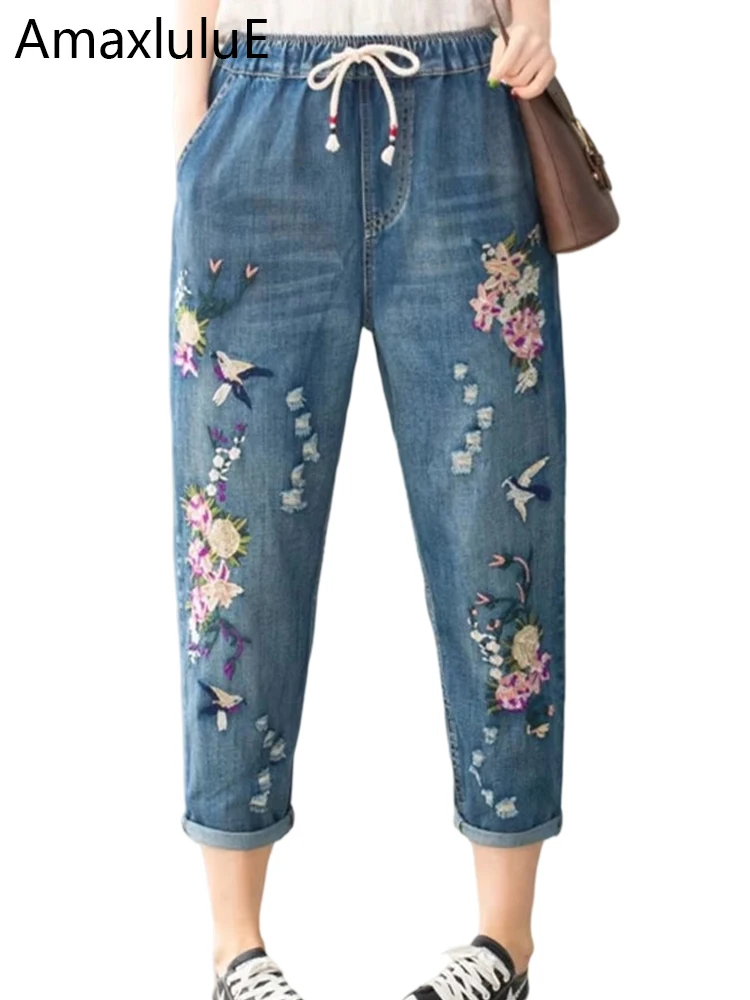 Niebieskie jeansy damskie baggy z elastycznego denimu, z przetarciami