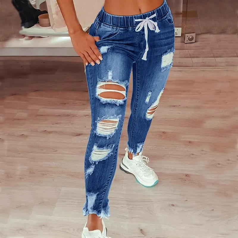 Jeansy damskie slim fit plus size, z elastycznego denimu, z przetarciami