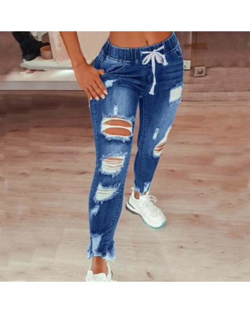 Jeansy damskie slim fit plus size, z elastycznego denimu, z przetarciami