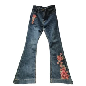 Niebieskie jeansy damskie flare z elastycznego denimu, z haftem