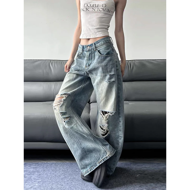 Niebieskie jeansy damskie baggy z wysokim stanem, z przetarciami