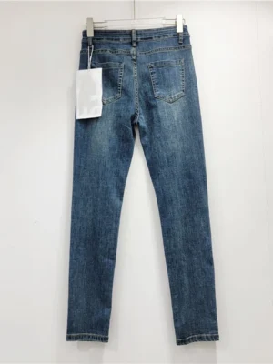 Jeansy damskie slim fit z kolorowym zdobieniem nogawek - ujęcie produktu