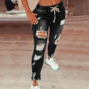 Jeansy damskie slim fit plus size, z elastycznego denimu, z przetarciami