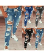 Jeansy damskie slim fit plus size, z elastycznego denimu, z przetarciami
