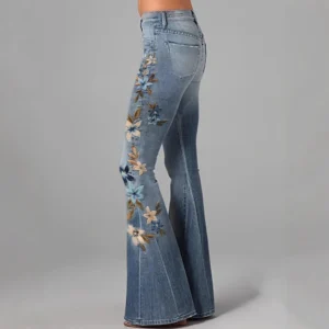 Niebieskie jeansy damskie z elastycznego denimu, z kwiatowym wzorem
