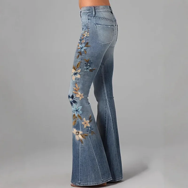 Niebieskie jeansy damskie z elastycznego denimu, z kwiatowym wzorem