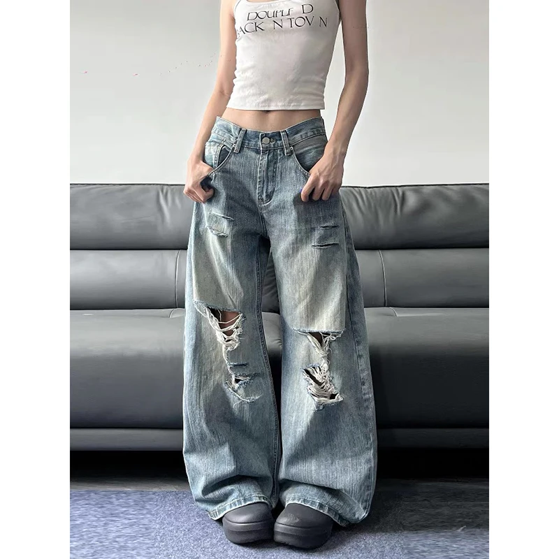 Niebieskie jeansy damskie baggy z wysokim stanem, z przetarciami