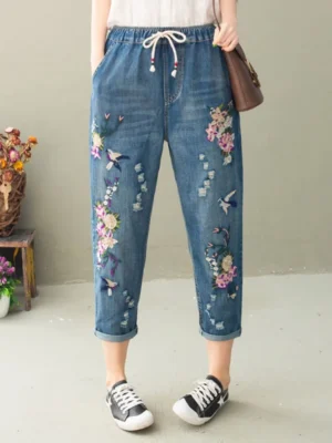 Niebieskie jeansy damskie baggy z elastycznego denimu, z przetarciami