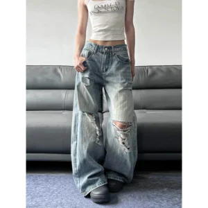 Niebieskie jeansy damskie baggy z wysokim stanem, z przetarciami