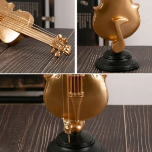 Złota figurka instrument muzyczny z żywicy