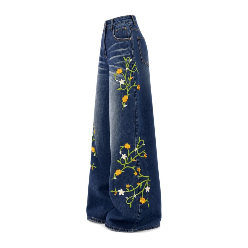 Jeansy damskie wide leg z haftem w kwiaty, wysoki stan, niebieskie - jeansy widok z boku na białym tle