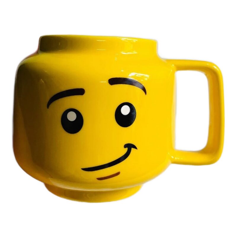 Kubek ceramiczny w kształcie głowy z buzią 250 ml, żółty, prezent - kubek z półuśmiechem, widok z boku 3/4