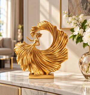 Złota figurka tancerki z żywicy 26,5 cm, nowoczesna dekoracja salonu - salon w stylu glamour, biała komoda, szklany wazon z żółtymi orchideami, ciemny obraz w tle